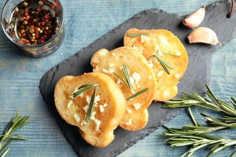 Flat lay composition with homemade garlic bread on table Stock Photos