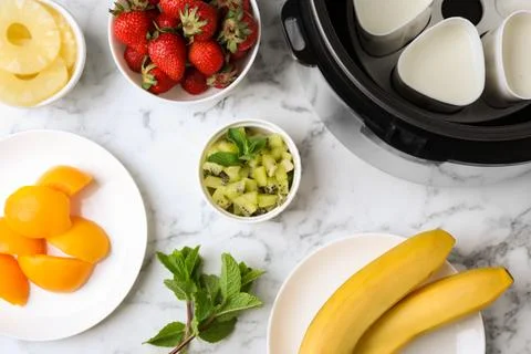 Flat lay composition with ingredients for yogurt on marble background. Multi  Foto stock