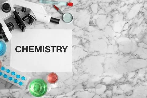 Flat lay composition with laboratory glassware, microscope and space for text Stock Photos