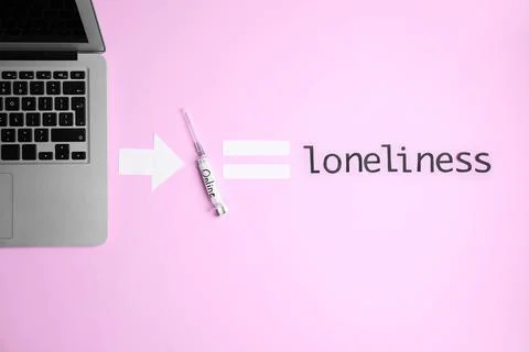 Flat lay composition with laptop, syringe and word LONELINESS on color backgr Foto stock