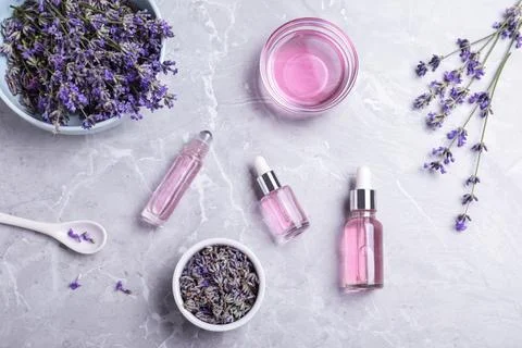 Flat lay composition with lavender essential oil on marble background Stock Photos