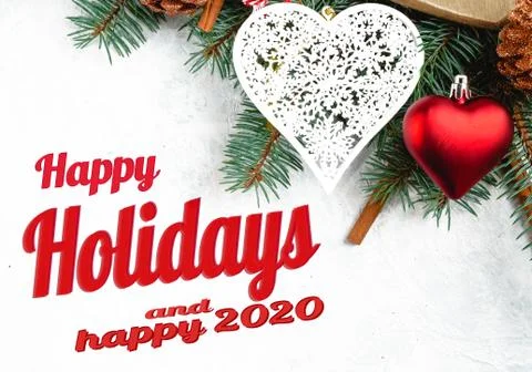 Flat lay composition with the lettering, happy holidays and happy 2020. Frame Photos