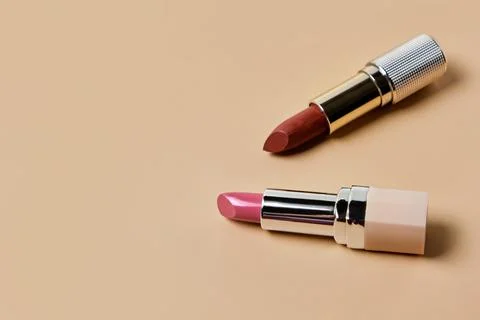 Flat lay composition with lipsticks and space for text on color background Stock Photos
