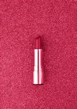 Flat lay composition with lipsticks on bright sparkling background. Toned image Stock Photos