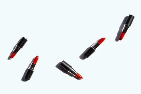 Flat lay composition, Lipsticks on white background with shadow. Beautiful Ma Stock Photos