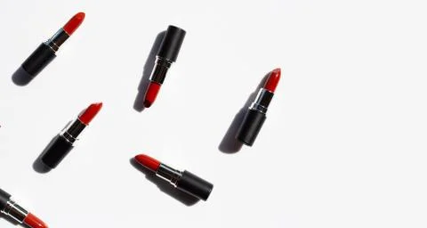Flat lay composition, Lipsticks on white background with shadow. Beautiful Ma Stock Photos