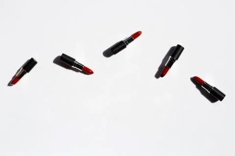 Flat lay composition, Lipsticks on white background with shadow. Beautiful Ma Stock Photos