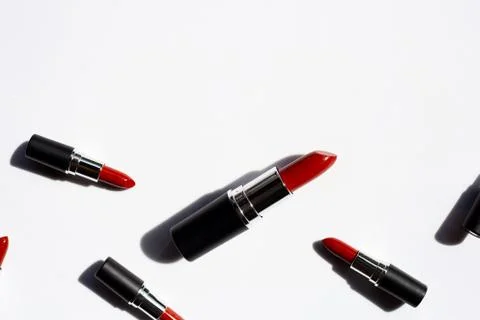 Flat lay composition, Lipsticks on white background with shadow. Beautiful Ma Stock Photos
