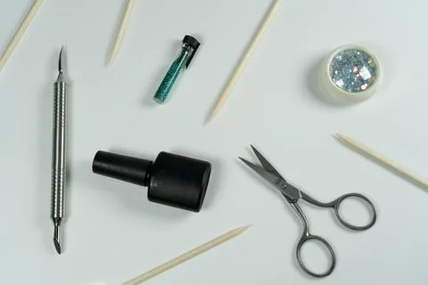 A flat-lay composition for a manicure professional, featuring tools like sc.. Stock Photos
