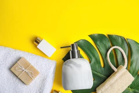 Flat lay composition with marble soap dispenser on yellow background. Space f Foto stock