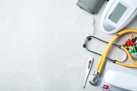 Flat lay composition with medical objects and space for text on grey backgrou Stock Photos