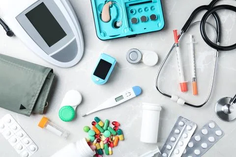 Flat lay composition with medical objects on grey background Stock Photos