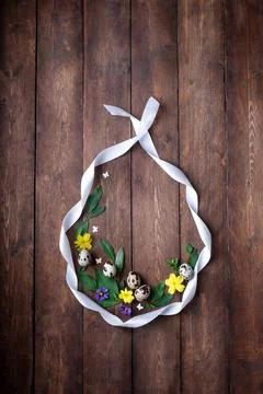 Flat lay composition with natural Easter eggs,fresh flowers and white ribbon egg Stock-Fotos