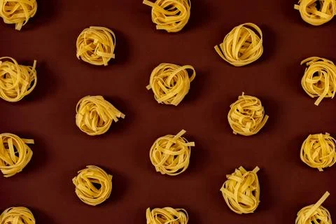 Flat lay composition with noodles raw on color background brown. Stock Photos