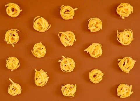 Flat lay composition with noodles raw on color background brown. Stock Photos