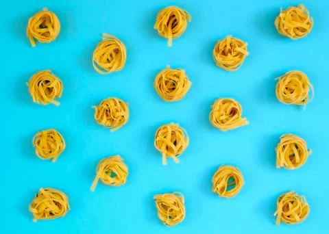 Flat lay composition with noodles raw on color background blue Stock Photos