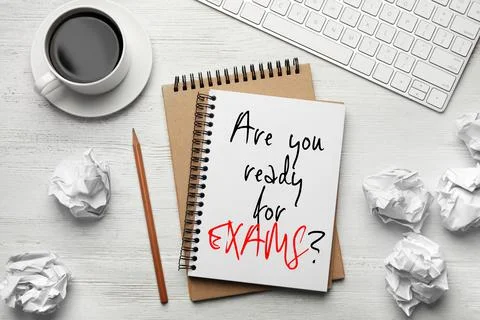 Flat lay composition of notebook with phrase ARE YOU READY FOR EXAMS and on w 스톡 사진