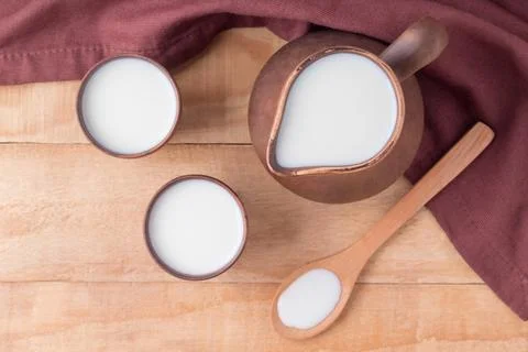 Flat lay composition with organic kefir, yogurt or ayran on wooden table Stock Photos