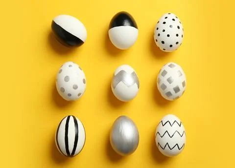 Flat lay composition with painted Easter eggs on color background Stock Photos