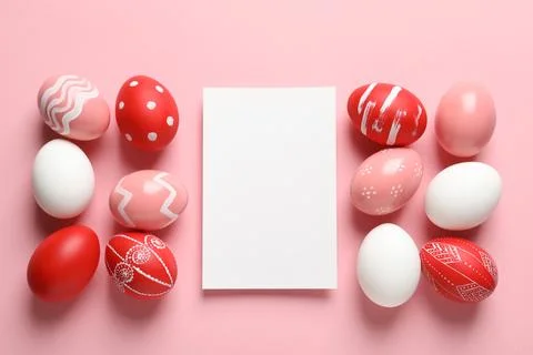 Flat lay composition of painted Easter eggs and card on color background, spa Stock Photos