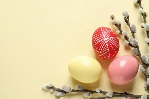 Flat lay composition with painted Easter eggs on color background, space for  Stock Photos