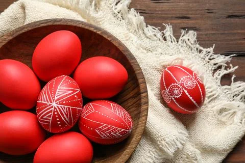 Flat lay composition with painted red Easter eggs on wooden table Stock Photos