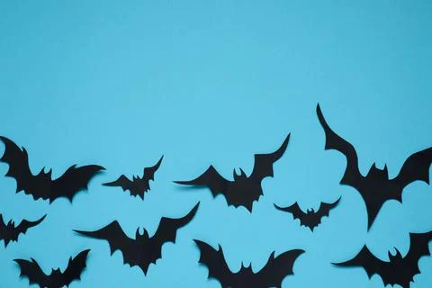 Flat lay composition with paper bats on light blue background, space for text Stock Photos