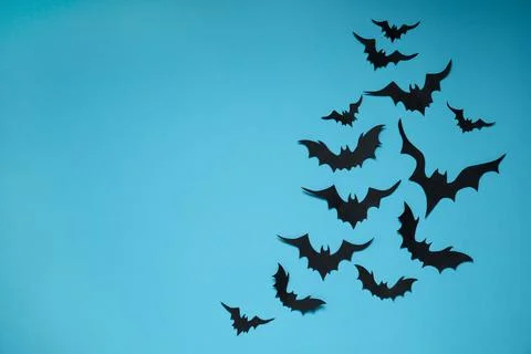 Flat lay composition with paper bats on light blue background, space for text Stock Photos