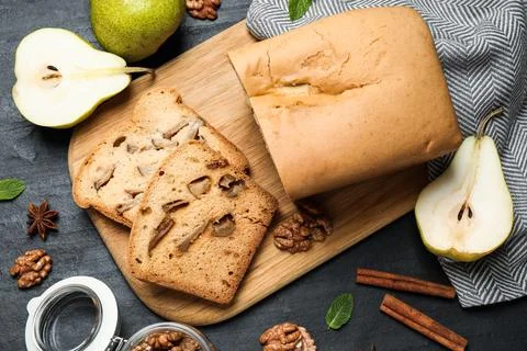 Flat lay composition with pear bread on black slate table. Homemade cake Stock Photos