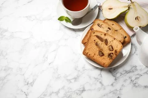 Flat lay composition with pear bread on white marble table, space for text. H Stock Photos