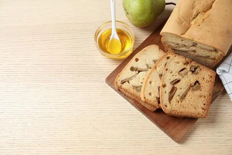 Flat lay composition with pear bread on wooden table, space for text. Homemad Stock Photos