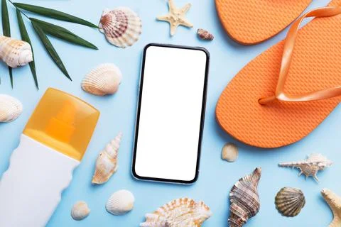 Flat lay composition with Phone and beach accessories on colored background.. Stock Photos