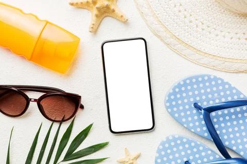 Flat lay composition with Phone and beach accessories on colored background.. Stock Photos