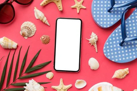 Flat lay composition with Phone and beach accessories on colored background.. Stock Photos