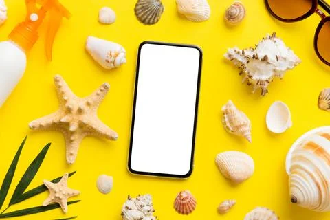 Flat lay composition with Phone and beach accessories on colored background.. Stock Photos