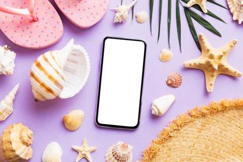 Flat lay composition with Phone and beach accessories on colored background.. Stock Photos