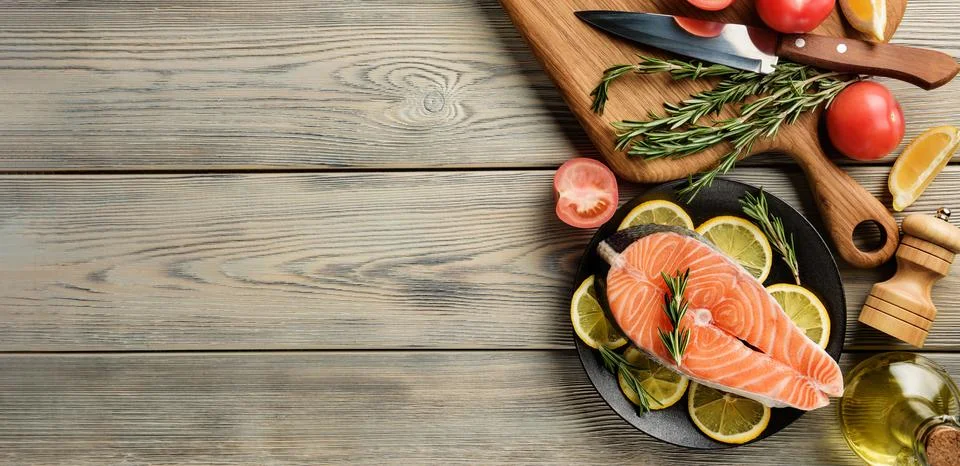 Flat lay composition with raw salmon steak and ingredients for cooking on the Stock Photos