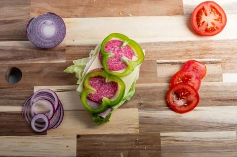 Flat lay composition of red onion slices on wooden surface  food preparatio.. Stock Photos