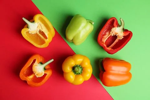 Flat lay composition with ripe bell peppers on color background Stock Photos