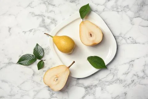 Flat lay composition with ripe pears on marble background Stock Photos
