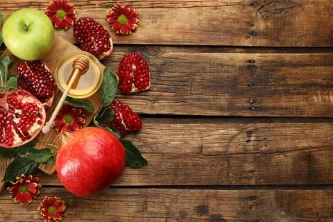 Flat lay composition with Rosh Hashanah holiday attributes on wooden table. S Stock Photos