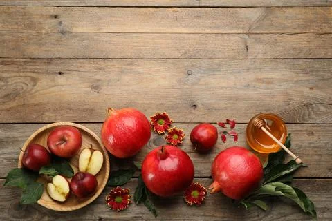 Flat lay composition with Rosh Hashanah holiday attributes on wooden table. S Stock Photos