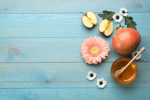 Flat lay composition with Rosh Hashanah holiday attributes on light blue wood Stock Photos