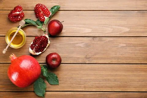 Flat lay composition with Rosh Hashanah holiday attributes on wooden table. S Stock Photos