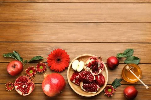 Flat lay composition with Rosh Hashanah holiday attributes on wooden table. S Stock Photos