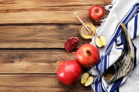 Flat lay composition with Rosh Hashanah holiday attributes on wooden table. S Stock Photos