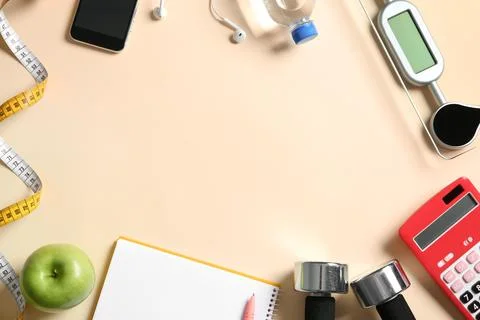 Flat lay composition with scales, measuring tape, calculator and space for te Stock Photos