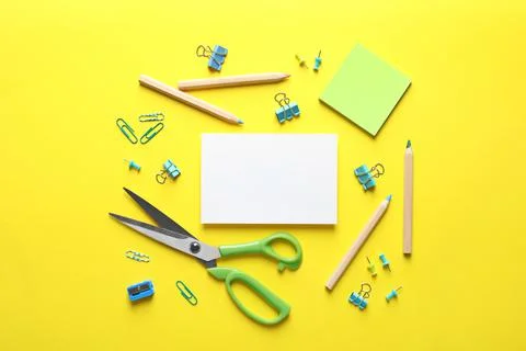 Flat lay composition with scissors and office supplies on color background. S 写真素材