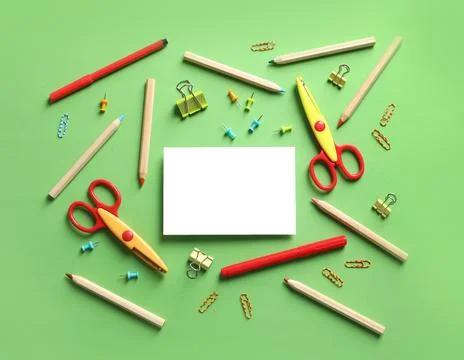 Flat lay composition with scissors and school supplies on color background. S Stock Photos