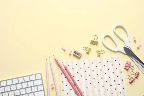 Flat lay composition with scissors and office supplies on color background. S Stock Photos